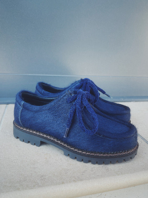 Derby blu in cavallino